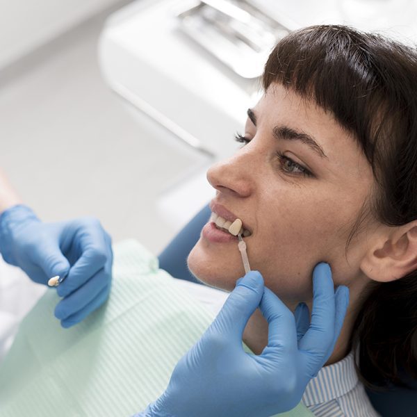 female-patient-having-procedure-done-dentist